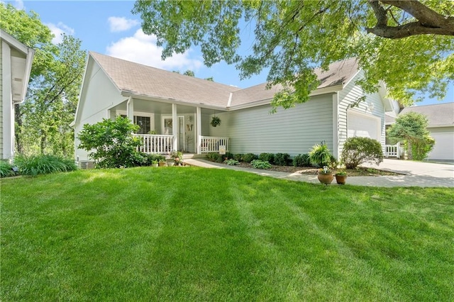 single story home featuring covered porch, a front yard, an attached garage, and concrete driveway