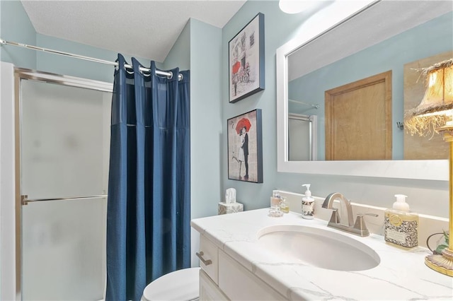 bathroom featuring curtained shower, toilet, and vanity