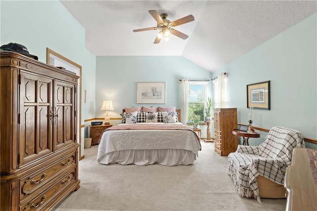 bedroom with light colored carpet, lofted ceiling, and a ceiling fan