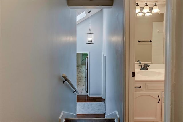 1205 SW 20th St, Blue Springs, MO 64015 - staircase featuring a chandelier and high vaulted ceiling