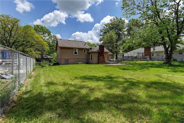 1205 SW 20th St, Blue Springs, MO 64015 - rear view of house with a chimney