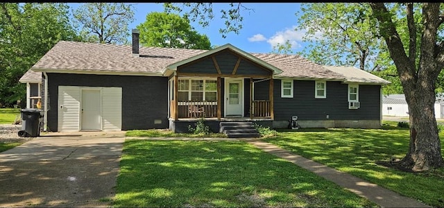 305 8th St, Oswego, KS 67356 - view of front of house with a front lawn, a chimney, and a porch