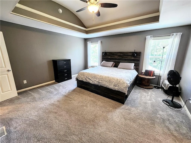 carpeted bedroom with vaulted ceiling, baseboards, crown molding, and ceiling fan