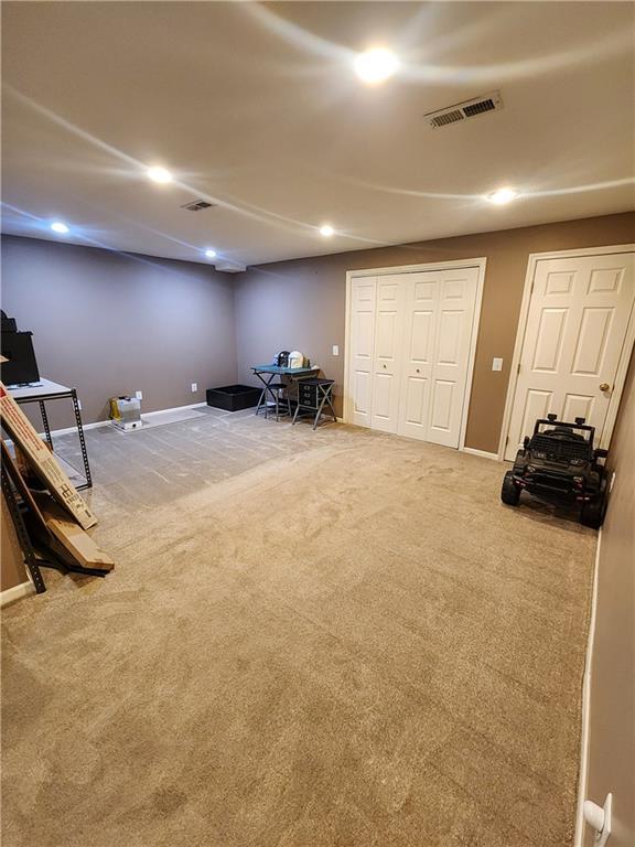 recreation room featuring carpet flooring, recessed lighting, and baseboards