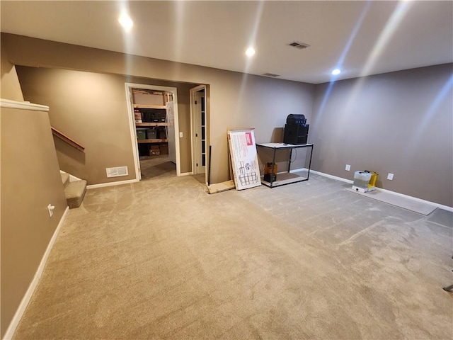 unfurnished office featuring carpet floors, baseboards, and recessed lighting
