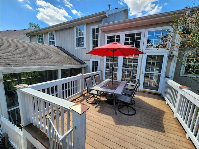 deck featuring outdoor dining area