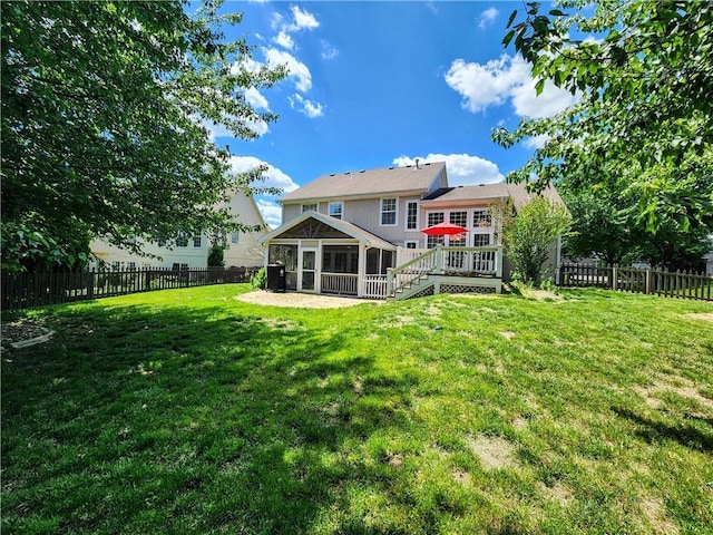 rear view of property featuring a sunroom