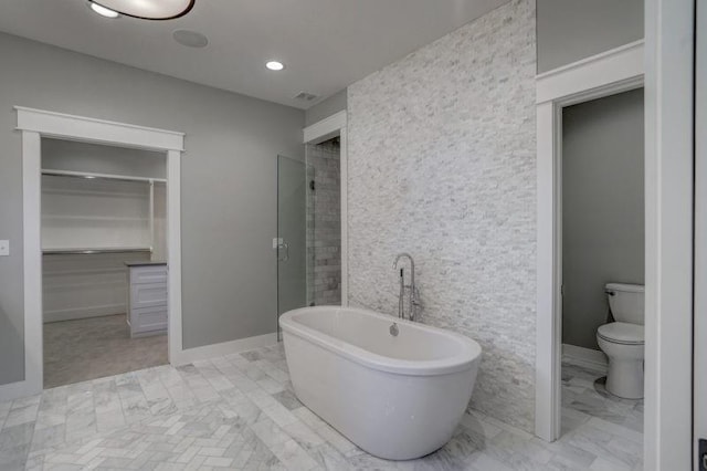 2807 W 50th Ter, Westwood, KS 66205 - full bathroom featuring a soaking tub, a spacious closet, toilet, a shower stall, and recessed lighting