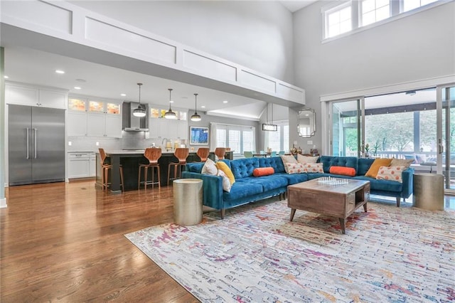 2807 W 50th Ter, Westwood, KS 66205 - living room with a high ceiling, wood finished floors, and recessed lighting