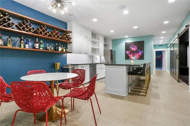 2807 W 50th Ter, Westwood, KS 66205 - dining space featuring recessed lighting and a barn door