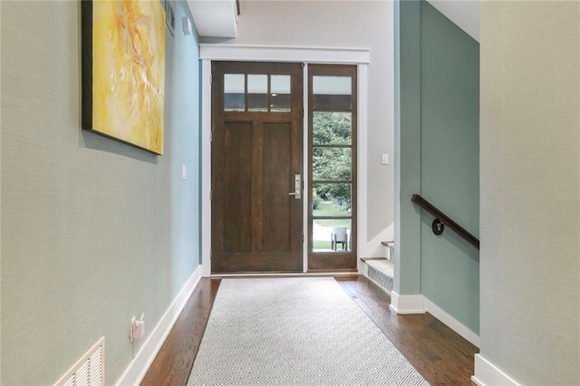 2807 W 50th Ter, Westwood, KS 66205 - foyer entrance featuring dark wood finished floors, baseboards, and stairway