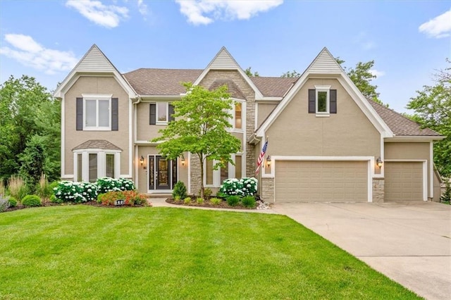 8407 W 141st St, Overland Park, KS 66223 - view of front of property featuring stone siding, concrete driveway, a front lawn, and stucco siding