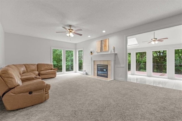 8407 W 141st St, Overland Park, KS 66223 - living area with a ceiling fan, carpet flooring, healthy amount of natural light, a textured ceiling, and recessed lighting