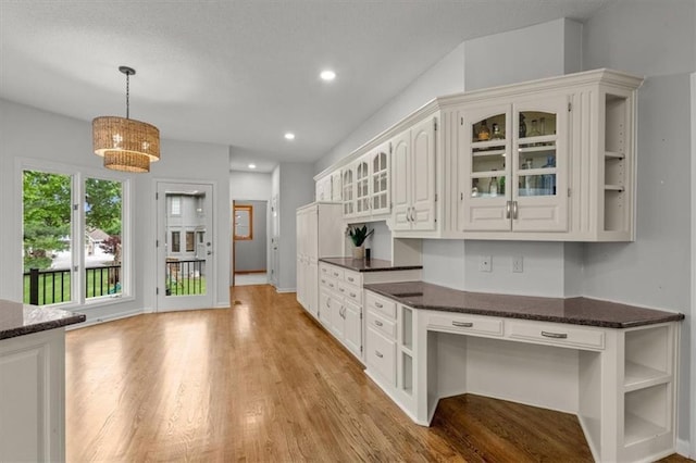 8407 W 141st St, Overland Park, KS 66223 - kitchen with light wood-style floors, glass insert cabinets, open shelves, and recessed lighting