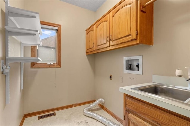 8407 W 141st St, Overland Park, KS 66223 - laundry area featuring cabinet space, electric dryer hookup, washer hookup, tile patterned floors, and baseboards