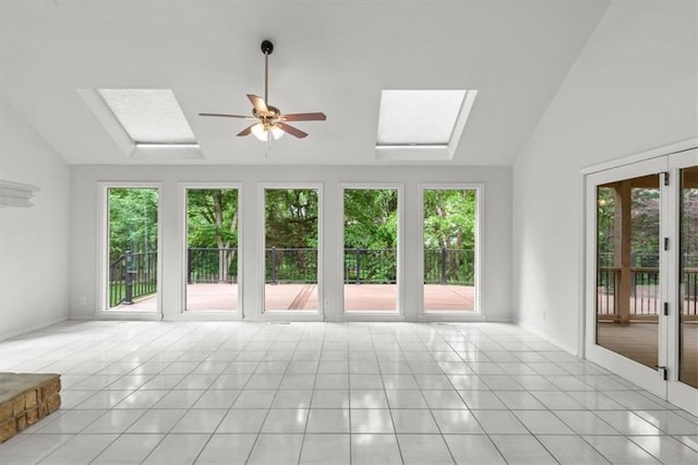 8407 W 141st St, Overland Park, KS 66223 - unfurnished living room featuring lofted ceiling, a skylight, light tile patterned floors, a ceiling fan, and baseboards
