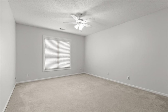 8407 W 141st St, Overland Park, KS 66223 - empty room with light colored carpet, a ceiling fan, a textured ceiling, and baseboards