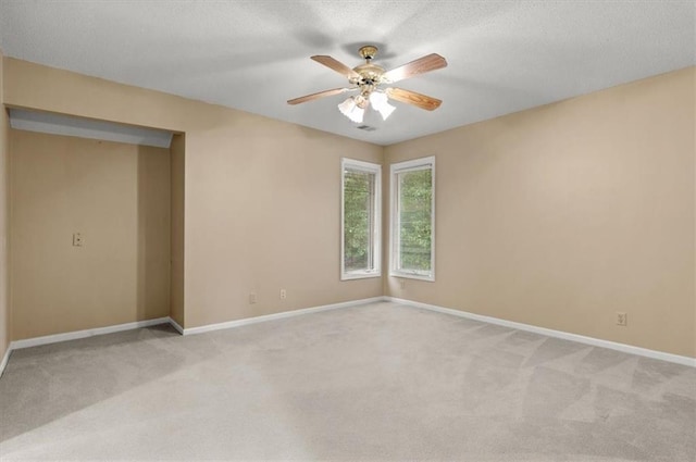 8407 W 141st St, Overland Park, KS 66223 - spare room featuring light carpet, ceiling fan, baseboards, and a textured ceiling