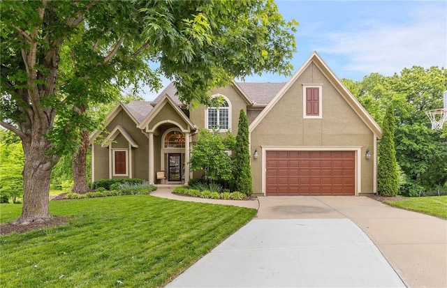 22614 W 46th Ter, Shawnee, KS 66226 - traditional-style house with concrete driveway, a front lawn, stucco siding, and an attached garage