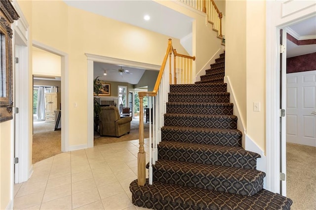 22614 W 46th Ter, Shawnee, KS 66226 - stairs with carpet flooring, a fireplace, a ceiling fan, plenty of natural light, and recessed lighting
