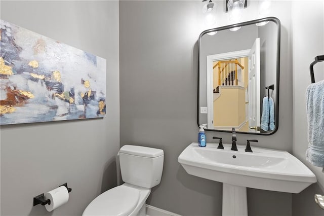 22614 W 46th Ter, Shawnee, KS 66226 - half bathroom with toilet, baseboards, and a sink