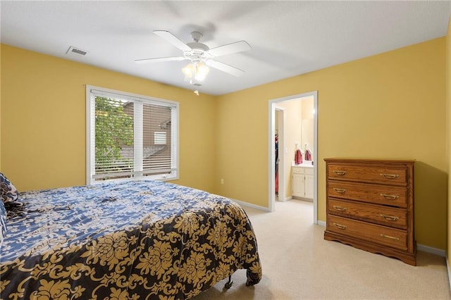 22614 W 46th Ter, Shawnee, KS 66226 - bedroom with light carpet, baseboards, connected bathroom, and ceiling fan