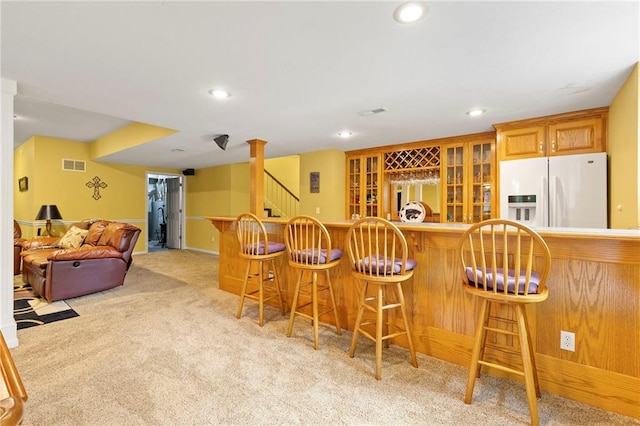22614 W 46th Ter, Shawnee, KS 66226 - indoor wet bar with white fridge with ice dispenser, light carpet, recessed lighting, and stairs