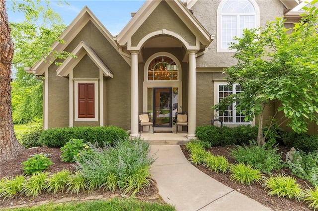 22614 W 46th Ter, Shawnee, KS 66226 - doorway to property with stucco siding and a porch
