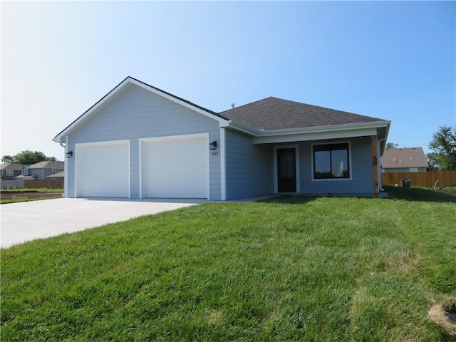 902 2nd St, Perry, KS 66073 - ranch-style home with driveway, a garage, and roof with shingles