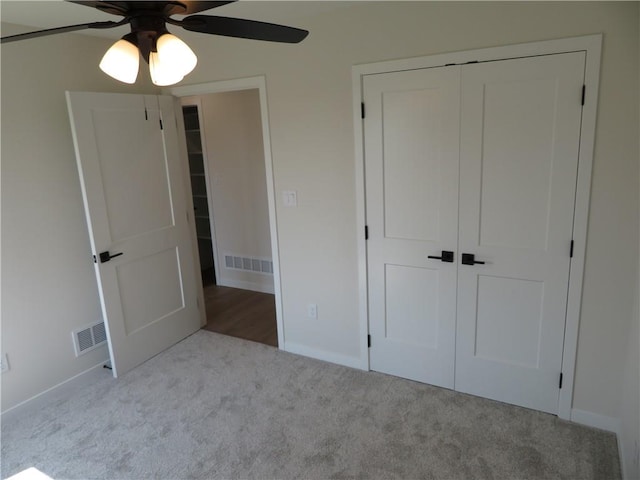 902 2nd St, Perry, KS 66073 - unfurnished bedroom with carpet, baseboards, a closet, and ceiling fan