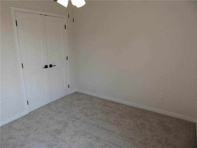 902 2nd St, Perry, KS 66073 - unfurnished bedroom with carpet flooring, baseboards, and a closet