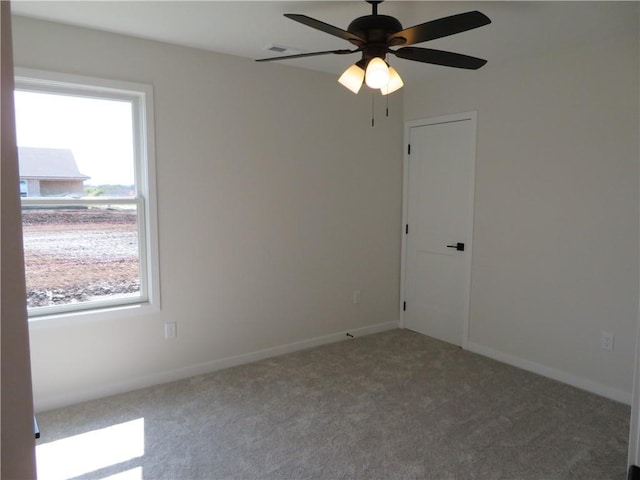 902 2nd St, Perry, KS 66073 - empty room featuring carpet, a ceiling fan, and baseboards