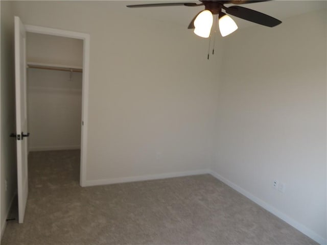 902 2nd St, Perry, KS 66073 - unfurnished bedroom featuring carpet floors, a walk in closet, and a closet