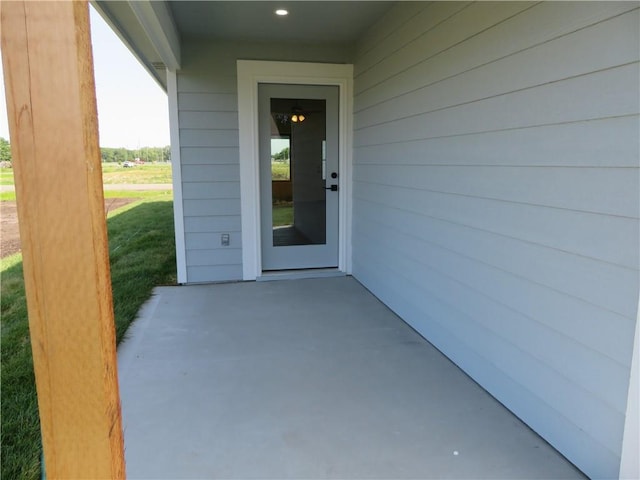 902 2nd St, Perry, KS 66073 - view of exterior entry featuring a patio area