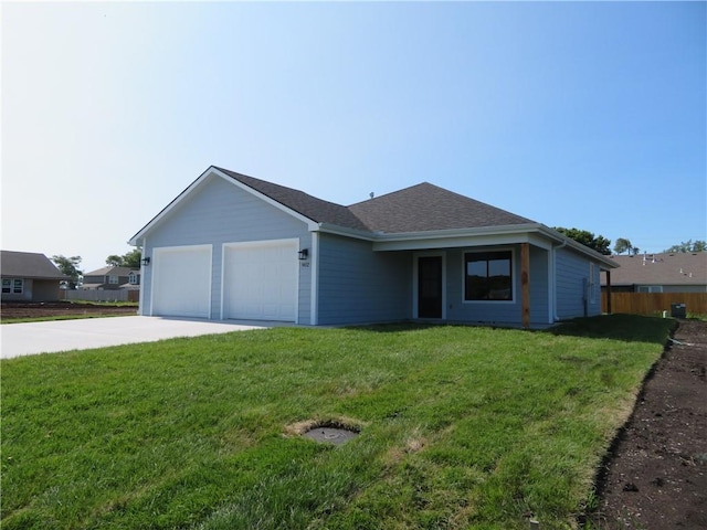 902 2nd St, Perry, KS 66073 - ranch-style home with driveway, an attached garage, and roof with shingles