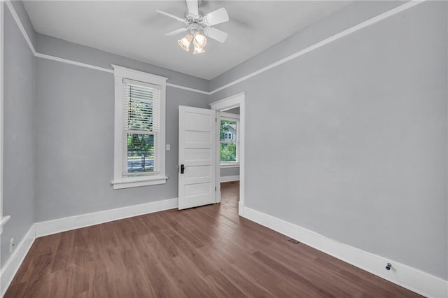 1010 N 13th St, Leavenworth, KS 66048 - spare room featuring wood finished floors, baseboards, and a ceiling fan