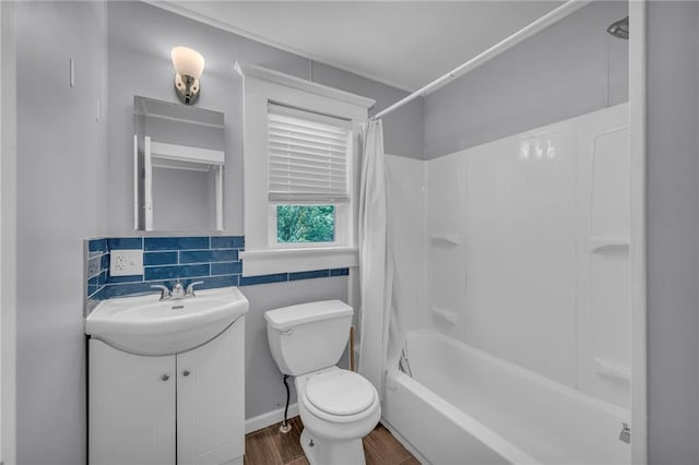 1010 N 13th St, Leavenworth, KS 66048 - full bathroom featuring vanity, wood finished floors, toilet, and shower / bath combo with shower curtain