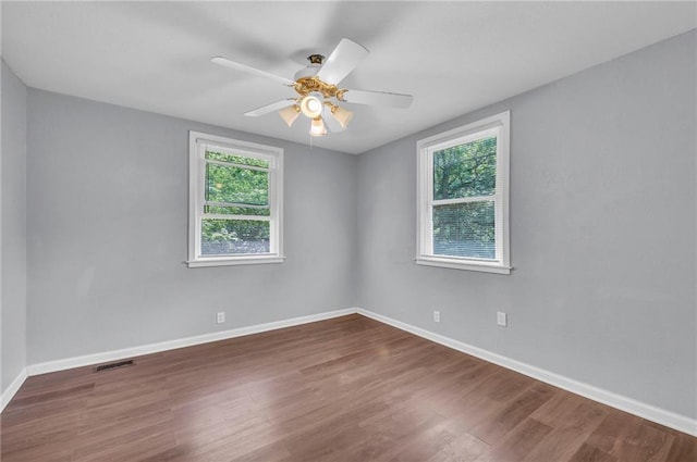 1010 N 13th St, Leavenworth, KS 66048 - spare room featuring plenty of natural light, wood finished floors, baseboards, and ceiling fan