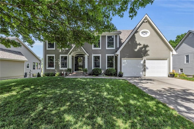 2007 NE Newport Ct, Blue Springs, MO 64014 - view of front of home with stucco siding, driveway, a garage, and a front lawn