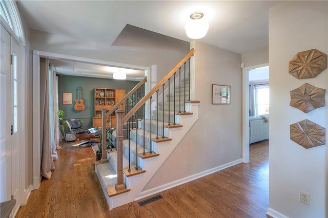 2007 NE Newport Ct, Blue Springs, MO 64014 - staircase featuring wood finished floors and baseboards