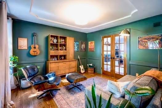 2007 NE Newport Ct, Blue Springs, MO 64014 - living area featuring french doors, wood finished floors, and a tray ceiling