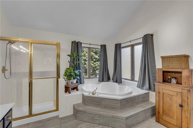 2007 NE Newport Ct, Blue Springs, MO 64014 - full bathroom with vaulted ceiling, a garden tub, a shower stall, and vanity