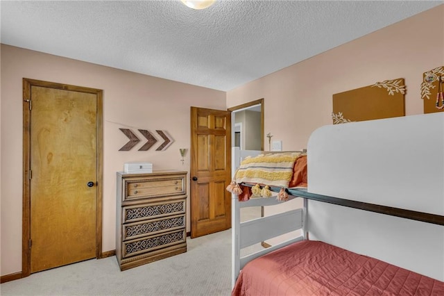 2007 NE Newport Ct, Blue Springs, MO 64014 - bedroom with carpet flooring, a textured ceiling, and baseboards