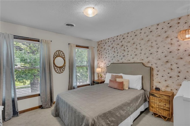 2007 NE Newport Ct, Blue Springs, MO 64014 - bedroom with carpet flooring, wallpapered walls, baseboards, a textured ceiling, and an accent wall