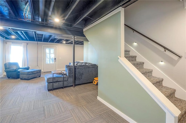 2007 NE Newport Ct, Blue Springs, MO 64014 - living room featuring carpet, stairway, and baseboards