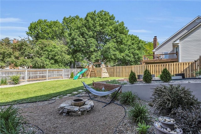 2007 NE Newport Ct, Blue Springs, MO 64014 - view of yard with an outdoor fire pit and a playground
