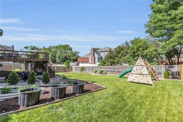2007 NE Newport Ct, Blue Springs, MO 64014 - view of yard with a vegetable garden, a playground, stairs, and a deck
