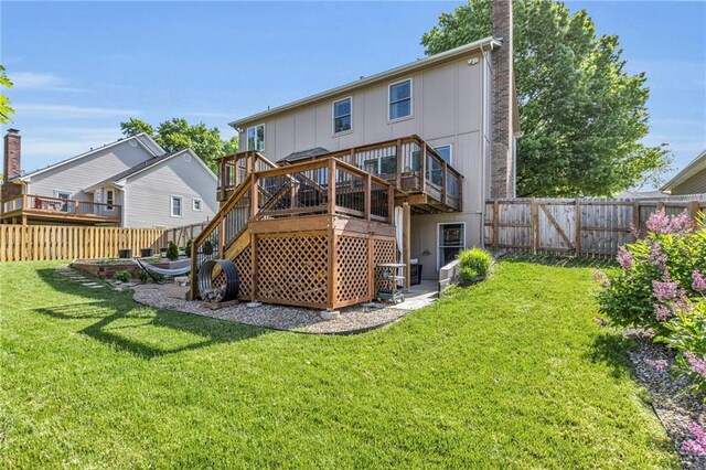 2007 NE Newport Ct, Blue Springs, MO 64014 - back of property featuring a wooden deck, stairway, and a chimney