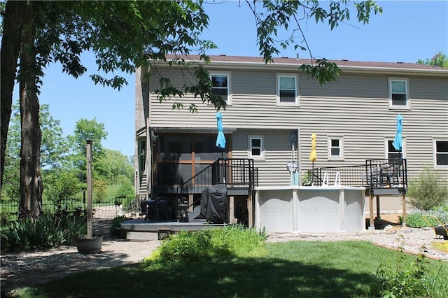 1658 NW 785th Rd, Bates City, MO 64011 - back of property featuring a wooden deck and an outdoor pool