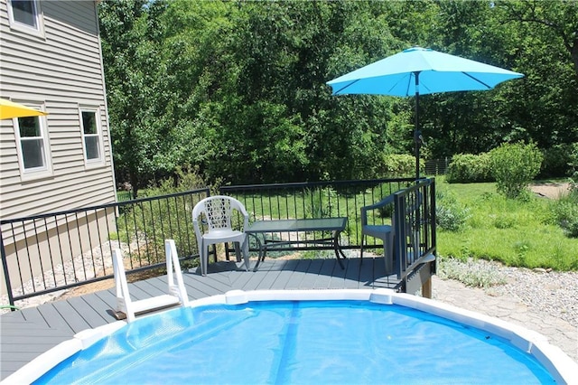 1658 NW 785th Rd, Bates City, MO 64011 - view of swimming pool with a wooden deck and view of scattered trees